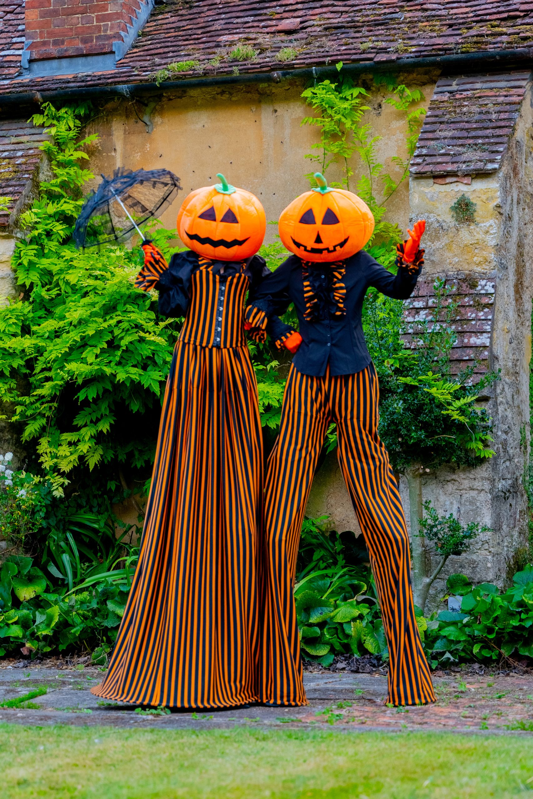 Halloween stilt walkers