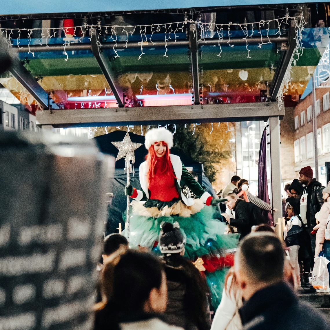 Stilt Walker at Christmas light switch on